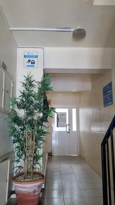 a hallway in a hospital with a plant in a pot at Budget Beach Center - B4 in Albufeira