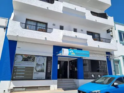a blue car parked in front of a building at Budget Beach Center - B4 in Albufeira