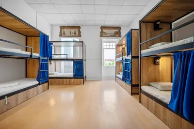 a hallway with bunk beds in a dorm room at Plaza Inn Hostel & Rooms in Faro