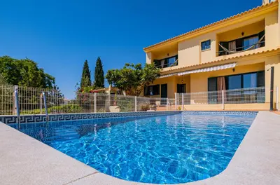 a swimming pool in front of a building at Retiro dos Calicos by Dreamplaces in Albufeira