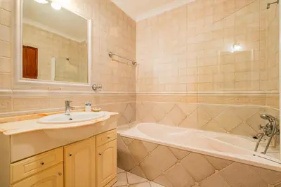 a bathroom with a sink and a bath tub at Retiro dos Calicos by Dreamplaces in Albufeira