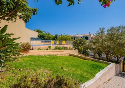 a park with stairs and grass in front of a building at Retiro dos Calicos by Dreamplaces in Albufeira
