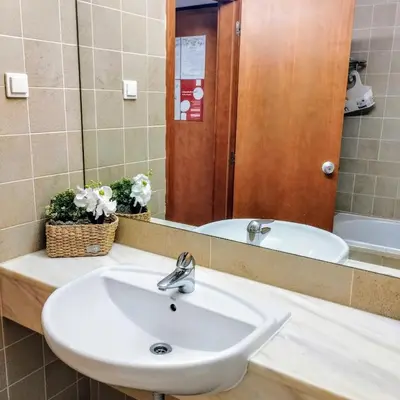 a bathroom with a sink and a mirror at 1- bedroom flat in Vilamoura near the beach in Vilamoura