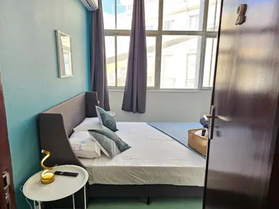 a small room with a bed and a window at Blife Lusitanya - private rooms at Santantonya 1st floor in Faro