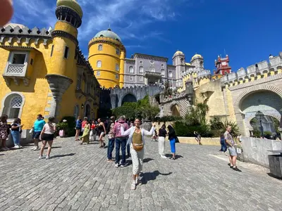 a group of people standing in front of a castle at Quinta Oriana Bella suite in Paderne