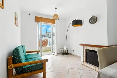a bathroom with a table and a fire extinguisher on the wall at T2 Apartment near the beach in Albufeira