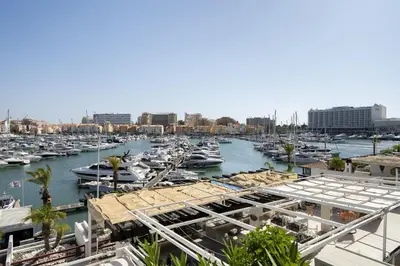 a marina filled with lots of boats in a harbor at Vilamarina Elegance T2 Marina View Vilamoura in Quarteira