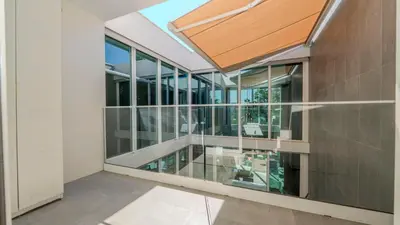 an interior view of a building with a skylight at Central Vilamoura Casa A in Quarteira