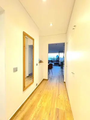 an empty room with a mirror and a hallway at Studio Estrelas Vilamoura in Vilamoura