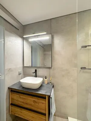 a bathroom with a sink and a mirror at Studio Estrelas Vilamoura in Vilamoura