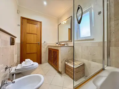 a bathroom with a sink and a toilet and a shower at Vilamoura Victoria Boulevard With Pool by Homing in Vilamoura