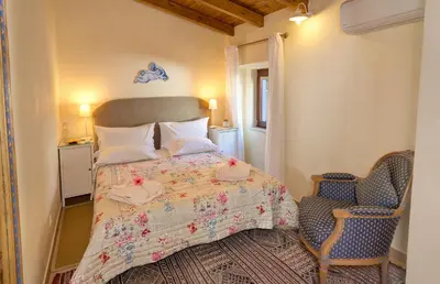 a bedroom with a bed and a chair at Perfect To Relax in Algoz