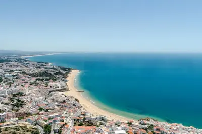 an aerial view of a beach and the ocean at White Studio and Terrace in Albufeira