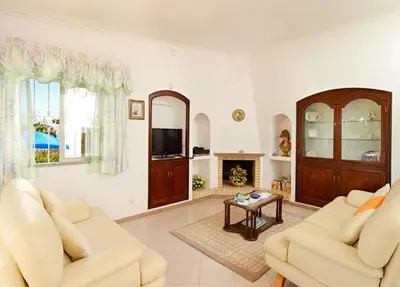 a living room with two couches and a table at Oliveira by Vintage Travel in Guia
