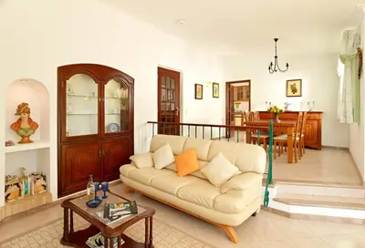 a living room with a couch and a table at Oliveira by Vintage Travel in Guia
