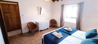 a bedroom with a bed with two towels on it at Quinta do Lagar - 01 in Albufeira