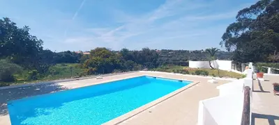 a swimming pool in a villa with a view at Quinta do Lagar - 05 in Albufeira