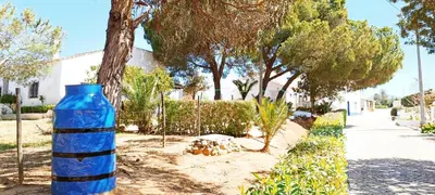 a blue bottle sitting on the side of a street at Quinta do Lagar - 06 in Albufeira