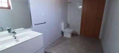 a bathroom with a sink and a toilet and a mirror at Quinta do Lagar - 08 in Albufeira