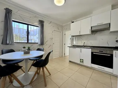 a living room with a couch and a fireplace at Albufeira Summer Villa 3 With Pool by Homing in Sesmarias