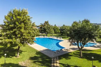 an overhead view of a swimming pool in a park at Casa Alonso 2 Bedroom Apartment with Pool in Albufeira