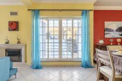 a dining room with a table and chairs at #343 Villa with Pool & Jacuzzi by Home Holidays in Albufeira