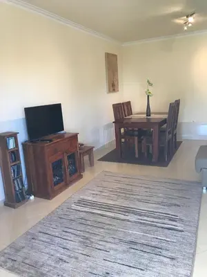 a living room with a couch and a fireplace at Açoteias Townhouse Villa T2 1 in Roja- Pé