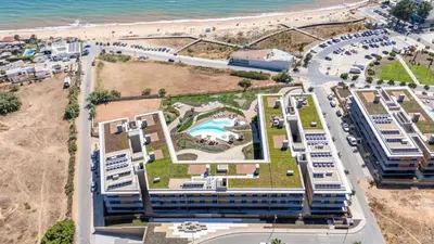 an aerial view of a resort near the beach at Luxury Flats with Pool in Quarteira by LovelyStay in Quarteira