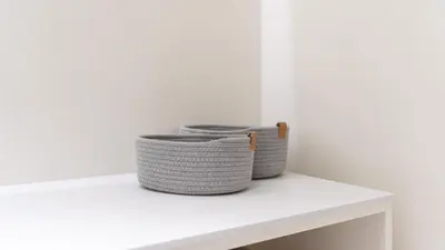 two baskets sitting on top of a white shelf at Luxury Flats with Pool in Quarteira by LovelyStay in Quarteira