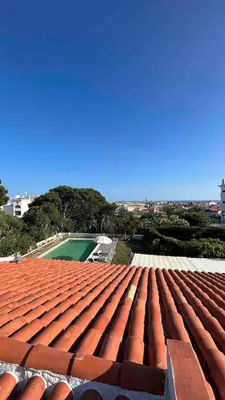 a view of a red roof of a building at Villa with pool in the Heart of Oura - Albufeira in Albufeira