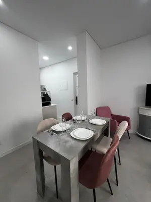 a dining room with a table and chairs at Cantinho da Paz in Faro