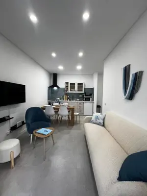 a living room with a couch and a table at Cantinho da Paz in Faro