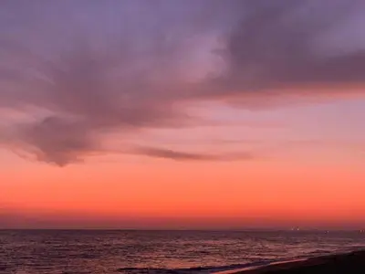 a sunset over the ocean with a colorful sky at Villa mar e Serra in Loulé