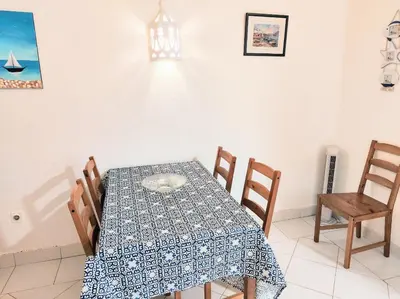 a dining room with a table and chairs at Albufeira Pescadores Sea view in Albufeira