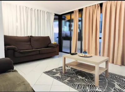 a living room with a couch and a coffee table at Albufeira Pescadores Sea view in Albufeira