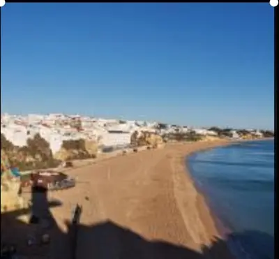 a view of a sandy beach with the ocean at Albufeira Pescadores Sea view in Albufeira
