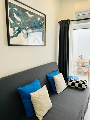 a shelf with a plant and a blue bottle on it at Casa Eliz Modern Comfort in the center of Faro in Faro