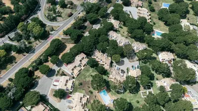 an aerial view of houses and a road at Serenity Villa Vilamoura in Quarteira