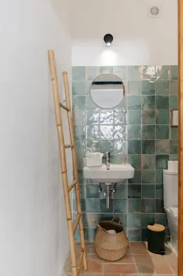 a bathroom with a sink and a mirror at Casa Majú - Algarve in Valados