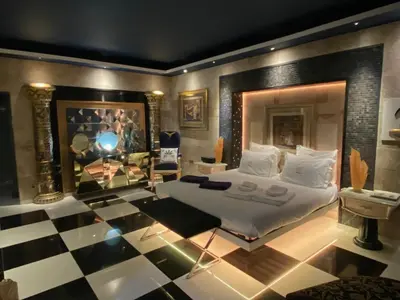a bedroom with a bed and a checkered floor at Villa Karolina in Quarteira