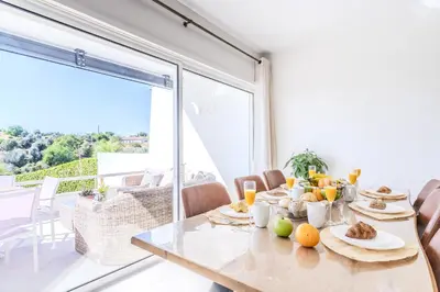 a dining room with a table with fruit on it at #339 Albufeira Terras Novas N 4 By Home Holidays in Patroves