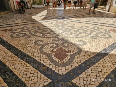 a mosaic floor with a heart on it on a street at Blife Europya - private rooms at Santantonya 3rd floor in Faro