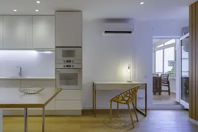 a kitchen with a table and a dining room at GINGKO BILOBA ROOF TOP by My Algarve Rentals in Quarteira
