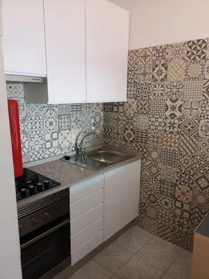 a bedroom with two beds and a window at Casa João Bravo in Albufeira