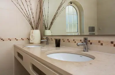 a bathroom with two sinks and a mirror at Luxury Villa with Private Pool, Gym & Leisure Room by Gale Beach LM25 in Guia