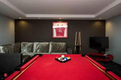 a living room with a red pool table at Luxury Villa with Private Pool, Gym & Leisure Room by Gale Beach LM25 in Guia