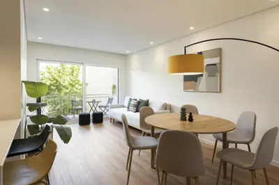 a living room with a table and a couch at Mira Mar 1 - Near the beach by HD in Quarteira