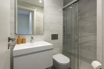a bathroom with a toilet and a sink and a shower at Mira Mar 1 - Near the beach by HD in Quarteira