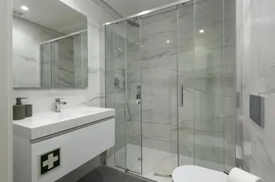 a bathroom with a shower and a sink and a toilet at Mira Mar 1 - Near the beach by HD in Quarteira