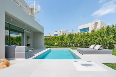 a swimming pool in the backyard of a house at New Villa - Rooftop Jacuzzi & Sunset Views in Santa Bárbara de Nexe